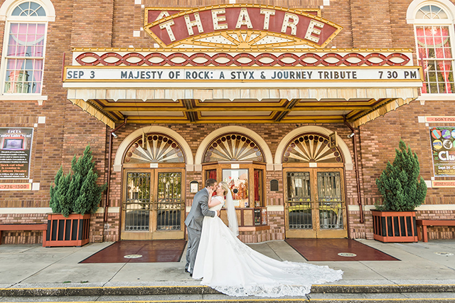 Groom and Bride in a Theatre Front Entrance