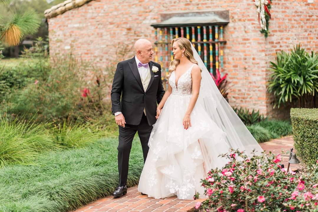 Couple in Front of House